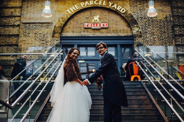 Couple in front of The Parcel Yard doors
